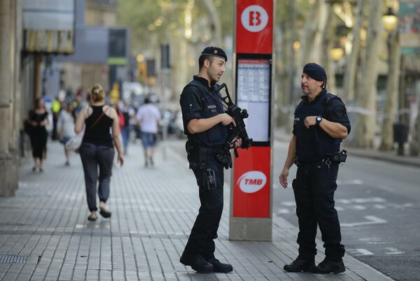 Armed police officers patrol a street in Las Ramblas, Barcelona, Spain, Friday, Aug. 18, 2017 Armed police officers patrol a street in Las Ramblas, Barcelona, Spain, Friday, Aug. 18, 2017 - Sputnik International