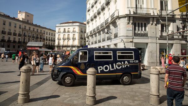 A police van drives by at Madrid's Puerta del Sol square, Spain, August 18, 2017 - Sputnik International