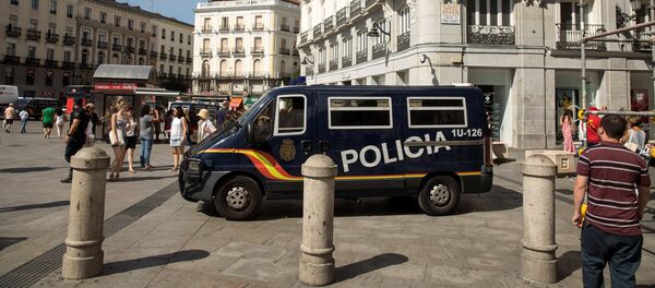 A police van drives by at Madrid's Puerta del Sol square, Spain, August 18, 2017 A police van drives by at Madrid's Puerta del Sol square, Spain, August 18, 2017 - Sputnik International