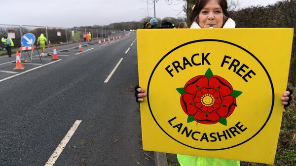 (File) Protesters hold placards at the Preston New Road site where Energy firm Cuadrilla are setting up fracking (hydraulic fracturing) operations at Little Plumpton near Blackpool in northwest England on January 10, 2017 - Sputnik International