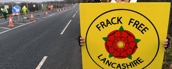 (File) Protesters hold placards at the Preston New Road site where Energy firm Cuadrilla are setting up fracking (hydraulic fracturing) operations at Little Plumpton near Blackpool in northwest England on January 10, 2017 - Sputnik International