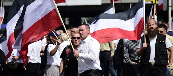 Extreme right-wings demonstrators gather prior to a neo-Nazi rally on the occasion of the 30th anniversary of the death of Hitler's deputy Rudolf Hess in Berlin Spandau on August 19, 2017. Extreme right-wings demonstrators gather prior to a neo-Nazi rally on the occasion of the 30th anniversary of the death of Hitler's deputy Rudolf Hess in Berlin Spandau on August 19, 2017. - Sputnik International