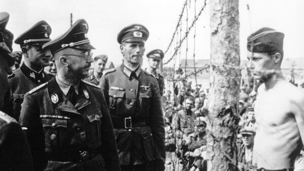 This undated photograph shows the Head of the Nazi German SS and Gestapo, Heinrich Himmler, as he inspects a German prisoner of war camp at an unknown location in the Soviet Union. - Sputnik International