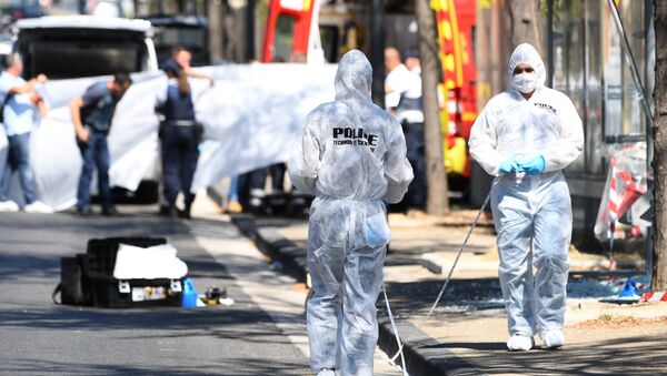 A white sheet is erected as a body of a victim is evacuated to a waiting ambulance while French forensic police officer search the site following a car crash on August 21, 2017, in the southern Mediterranean city of Marseille - Sputnik International