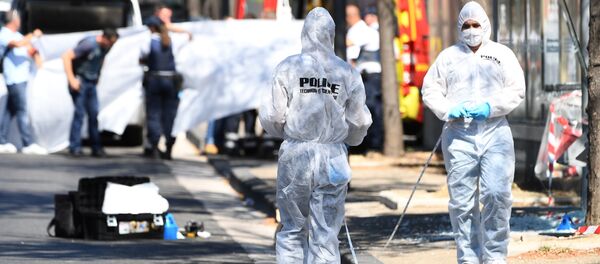 A white sheet is erected as a body of a victim is evacuated to a waiting ambulance while French forensic police officer search the site following a car crash on August 21, 2017, in the southern Mediterranean city of Marseille A white sheet is erected as a body of a victim is evacuated to a waiting ambulance while French forensic police officer search the site following a car crash on August 21, 2017, in the southern Mediterranean city of Marseille - Sputnik International