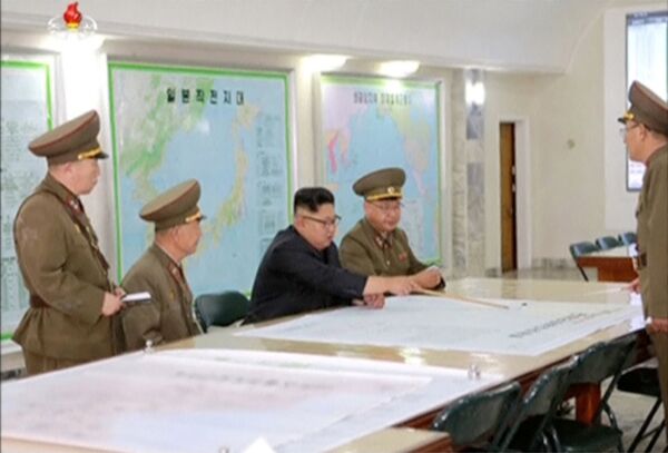 North Korean leader Kim Jong Un reviews the plan for landing missiles near the U.S. territory of Guam North Korean leader Kim Jong Un reviews the plan for landing missiles near the U.S. territory of Guam - Sputnik International