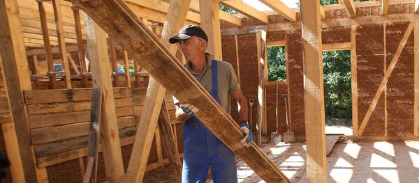 Construction of wooden houses. File photo - Sputnik International