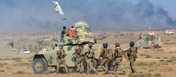 Shi'ite Popular Mobilization Forces (PMF) gather with Iraqi army on the outskirts of Tal Afar, Iraq, August 22, 2017 Shi'ite Popular Mobilization Forces (PMF) gather with Iraqi army on the outskirts of Tal Afar, Iraq, August 22, 2017 - Sputnik International