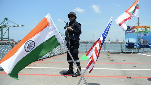 An Indian Navy sailor stands guard on the deck of the INS Shivalik during the inauguration of joint naval exercises with the United States and Japan in Chennai on July 10, 2017 - Sputnik International