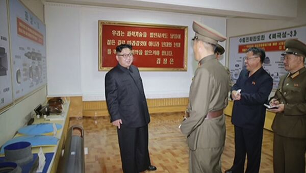 In this image made from video of a news bulletin aired by North Korea's KRT on Wednesday, Aug. 23, 2017, leader Kim Jong Un visits the Chemical Material Institute of Academy of Defense Science at an undisclosed location in North Korea. North Korea's state media released photos that appear to show concept diagrams of the missiles hanging on a wall behind leader Kim Jong Un, one showing a diagram for a missile called Pukguksong-3. Independent journalists were not given access to cover the event depicted in this photo. - Sputnik International