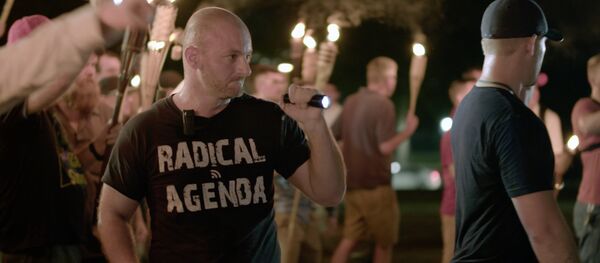 Aug. 11, 2017, image made from a video provided by Vice News Tonight, Christopher Cantwell attends a white nationalist rally in Charlottesville, Va Aug. 11, 2017, image made from a video provided by Vice News Tonight, Christopher Cantwell attends a white nationalist rally in Charlottesville, Va - Sputnik International