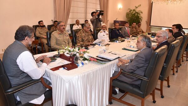 In this photo released by by Pakistan's Press Information Department, Prime Minister Shahid Khaqan Abbasi, left, heads a meeting of the National Security Committee in Islamabad, Pakistan, Thursday, Aug. 24, 2017 - Sputnik International