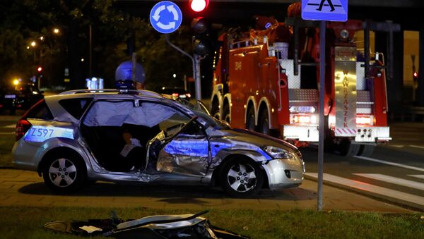 A police car, which is part of the motorcade transporting NATO General Secretary Jens Stoltenberg's delegation, is seen after an accident with a truck in Warsaw, Poland August 24, 2017 - Sputnik International