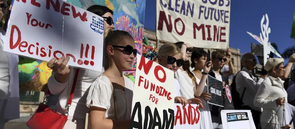 In this May 25, 2017 photo, environmental activists voice their opposition to Indian miner Adani's proposed Carmichael coal mine, outside Parliament House in Brisbane, Australia In this May 25, 2017 photo, environmental activists voice their opposition to Indian miner Adani's proposed Carmichael coal mine, outside Parliament House in Brisbane, Australia - Sputnik International