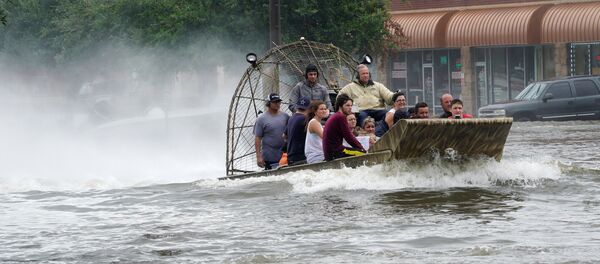 People are rescued from flood waters from Hurricane Harvey on an air boat in Dickinson, Texas People are rescued from flood waters from Hurricane Harvey on an air boat in Dickinson, Texas - Sputnik International