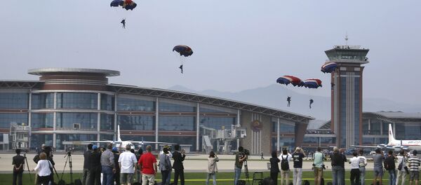 Military parachutists descend upon Kalma Airport on Sunday, Sept. 25, 2016, in Wonsan, North Korea. Military parachutists descend upon Kalma Airport on Sunday, Sept. 25, 2016, in Wonsan, North Korea. - Sputnik International