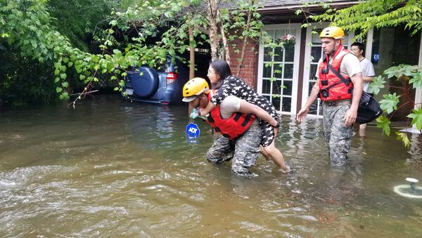 Texas National Guard soldiers aid stranded residents in heavily flooded areas from the storms of Hurricane Harvey in Houston, Texas, U.S - Sputnik International