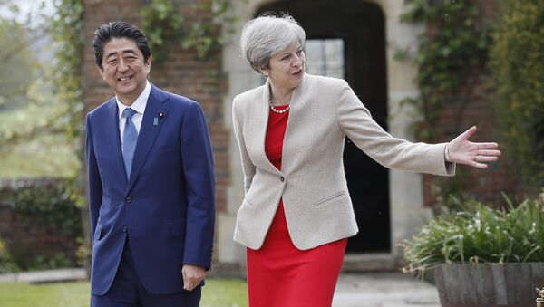 Britain's Prime Minister Theresa May shows Prime Minister Shinzo Abe of Japan around the garden at Chequers near Wendover, England, Friday, April 28, 2017. - Sputnik International