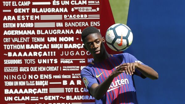 French soccer player Ousmane Dembele controls the ball during an official presentation at the Camp Nou stadium in Barcelona, Spain - Sputnik International