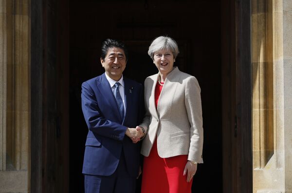 Britain's Prime Minister Theresa May (R) welcomes Japan's Prime Minister Shinzo Abe (L) at Chequers, the prime minister's official country residence, near Ellesborough, northwest of London, on April 28, 2017 Britain's Prime Minister Theresa May (R) welcomes Japan's Prime Minister Shinzo Abe (L) at Chequers, the prime minister's official country residence, near Ellesborough, northwest of London, on April 28, 2017 - Sputnik International