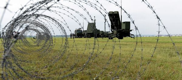 Soldiers from the Japan Air Self-Defense Force set up PAC-3 surface-to-air missile launch systems during a temporary deployment drill at US Yokota Air Base in Tokyo - Sputnik International