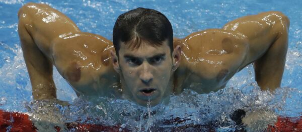 United States' Michael Phelps leaves the pool after winning a heat of the men's 200-meter individual medley during the swimming competitions at the 2016 Summer Olympics, Wednesday, Aug. 10, 2016, in Rio de Janeiro, Brazil. (File) United States' Michael Phelps leaves the pool after winning a heat of the men's 200-meter individual medley during the swimming competitions at the 2016 Summer Olympics, Wednesday, Aug. 10, 2016, in Rio de Janeiro, Brazil. (File) - Sputnik International