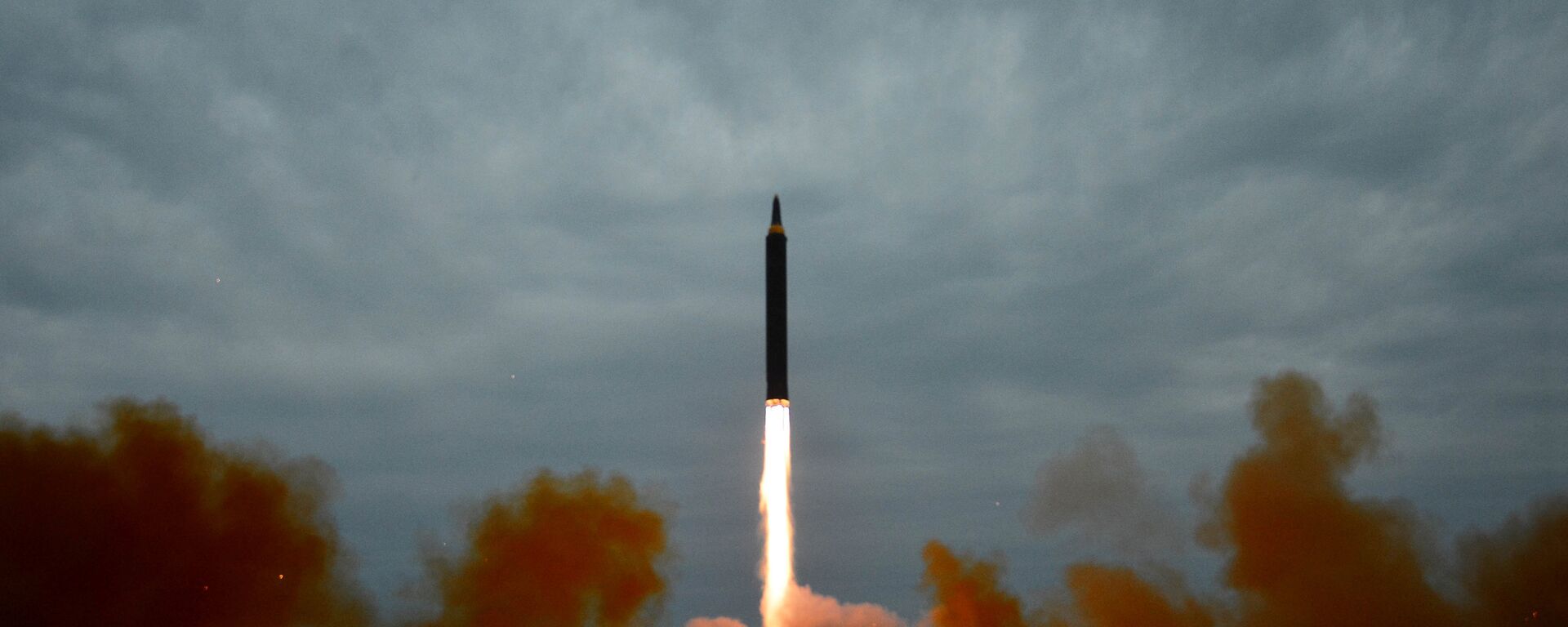A missile is launched during a long and medium-range ballistic rocket launch drill in this undated photo released by North Korea's Korean Central News Agency (KCNA) in Pyongyang on August 30, 2017. - Sputnik International, 1920, 28.09.2021