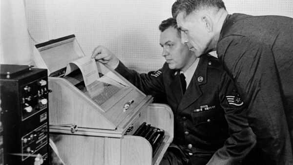 This Aug.30, 1963 black-and-white file photo shows the White House Kremlin hot line providing direct communication for emergency use by the Chief of Staff in Washington and Moscow, becaming operational. Air Force Sgt. John Bretoski, left, and Army Lt. Col. Charles Fitzgerald, man the equipment in the Pentagon during a test run. The Pentagon is the U.S. operating terminal for both the land line-transocean circuit and the alternate radio circuit, with a direct relay to the White House. - Sputnik International