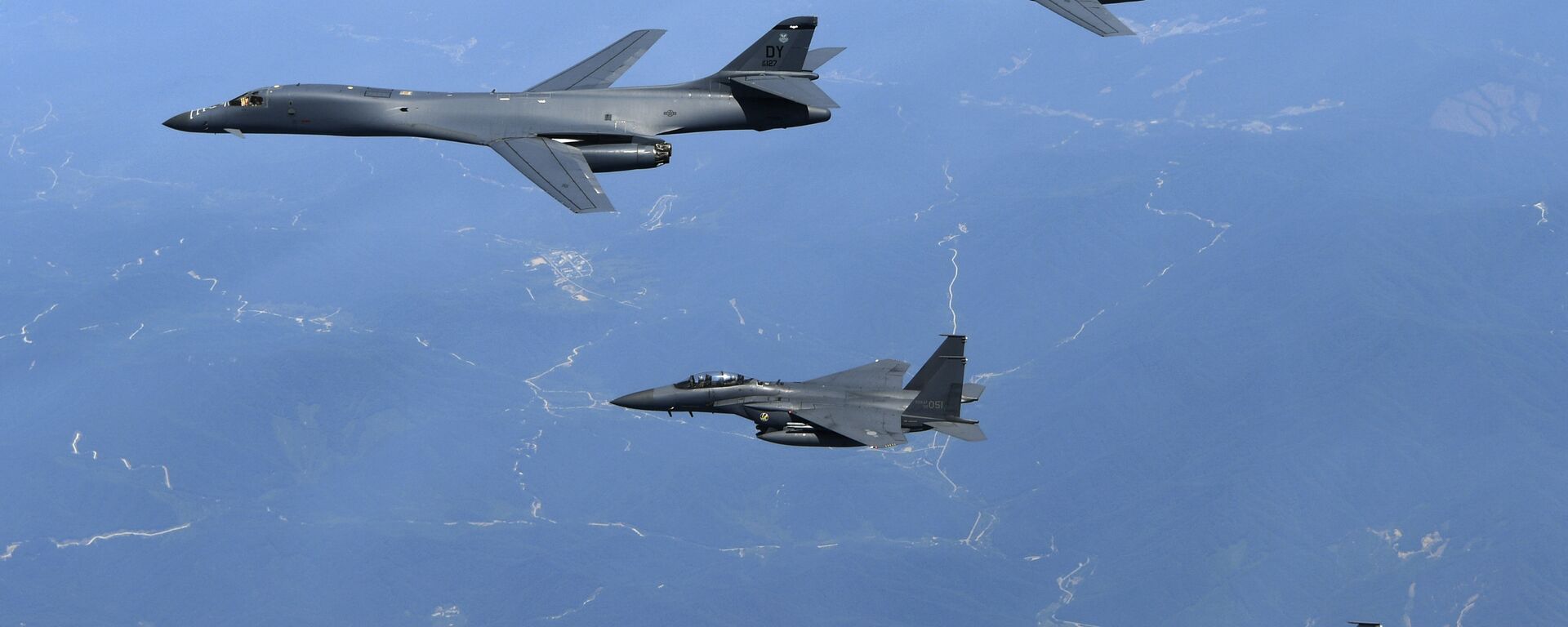 In this June 20, 2017 file photo provided by South Korean Defense Ministry, U.S. Air Force B-1B bombers, top, and second from top, and South Korean fighter jets F-15K fly over the Korean Peninsula, South Korea - Sputnik International, 1920, 17.04.2023