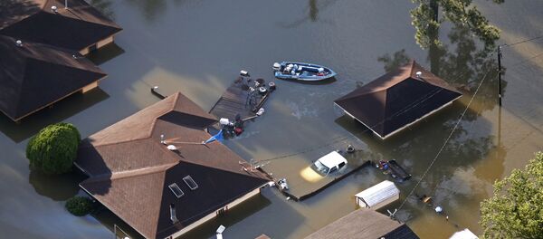 A boat sits near flooded homes in the aftermath of Tropical Storm Harvey in Beaumont, Texas, Thursday, Aug. 31, 2017. A boat sits near flooded homes in the aftermath of Tropical Storm Harvey in Beaumont, Texas, Thursday, Aug. 31, 2017. - Sputnik International