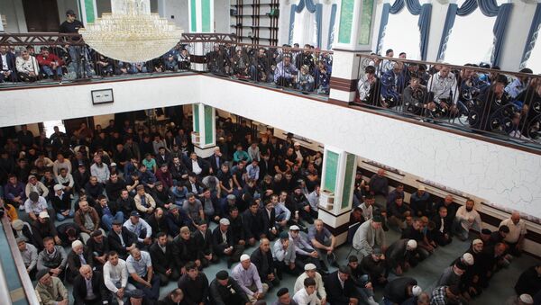 Muslims celebrating Eid al-Adha at a mosque in Ust-Dzheguta in the Russian Caucasus. - Sputnik International