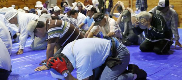 Local residents take part in an emergency drill in the wake of repeated missile launches by North Korea, in Takikawa on Japan's northernmost main island of Hokkaido, in this photo taken by Kyodo September 1, 2017 Local residents take part in an emergency drill in the wake of repeated missile launches by North Korea, in Takikawa on Japan's northernmost main island of Hokkaido, in this photo taken by Kyodo September 1, 2017 - Sputnik International