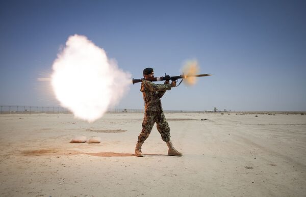 Afghan National Army soldier firing an RPG-7 Afghan National Army soldier firing an RPG-7 - Sputnik International