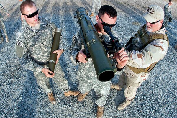 A civilian instructor coaches two paratroopers on how to use a Carl Gustav M3 84mm recoilless rifle during a certification course on Fort Bragg, N.C., Dec. 6, 2011 A civilian instructor coaches two paratroopers on how to use a Carl Gustav M3 84mm recoilless rifle during a certification course on Fort Bragg, N.C., Dec. 6, 2011 - Sputnik International