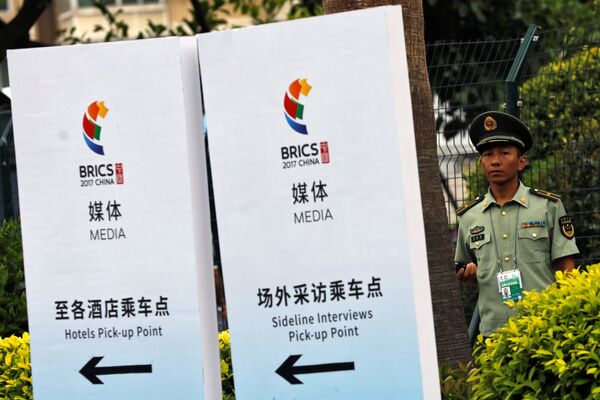 A paramilitary police officer stands outside the media center of BRICS (Brazil, Russia, India, China and South Africa) Summit in Xiamen, China September 2, 2017 A paramilitary police officer stands outside the media center of BRICS (Brazil, Russia, India, China and South Africa) Summit in Xiamen, China September 2, 2017 - Sputnik International
