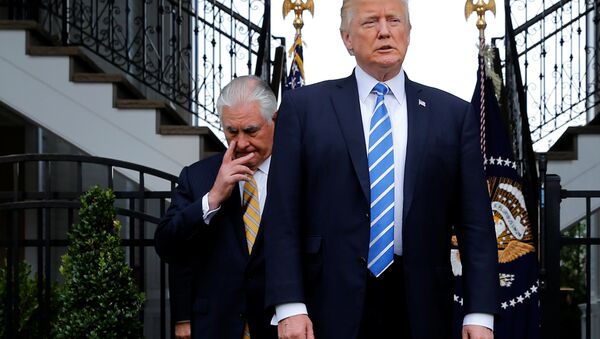 U.S. President Donald Trump (R), trailed by Secretary of State Rex Tillerson, arrives to speak to reporters after their meeting at Trump's golf estate in Bedminster, New Jersey U.S. August 11, 2017 - Sputnik International