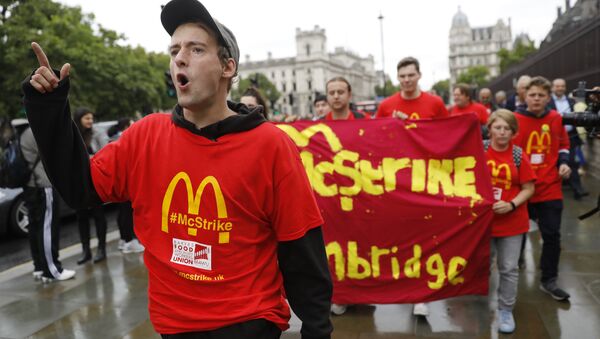 Demonstrators participate in a protest over working conditions and the use of zero-hour contracts at British outlets of US burger chain McDonalds, in central London - Sputnik International