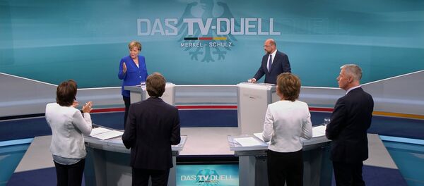 A screen that shows the TV debate between German Chancellor Angela Merkel of the Christian Democratic Union (CDU) and her challenger Germany's Social Democratic Party SPD candidate for chancellor Martin Schulz in Berlin, Germany, September 3, 2017. A screen that shows the TV debate between German Chancellor Angela Merkel of the Christian Democratic Union (CDU) and her challenger Germany's Social Democratic Party SPD candidate for chancellor Martin Schulz in Berlin, Germany, September 3, 2017. - Sputnik International