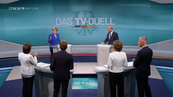 A screen that shows the TV debate between German Chancellor Angela Merkel of the Christian Democratic Union (CDU) and her challenger Germany's Social Democratic Party SPD candidate for chancellor Martin Schulz in Berlin, Germany, September 3, 2017. - Sputnik International