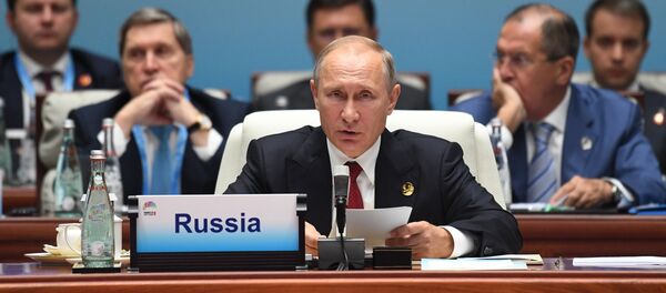 Russian President Vladimir Putin at the BRICS leaders expanded meeting Russian President Vladimir Putin at the BRICS leaders expanded meeting - Sputnik International