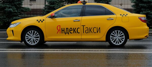 A car of the Yandex Taxi service in a street of Moscow A car of the Yandex Taxi service in a street of Moscow - Sputnik International