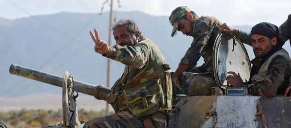 The Syrian army servicemen, broke the three-year siege of Deir ez-Zor, in the area of the 137th mechanized brigade in Syria The Syrian army servicemen, broke the three-year siege of Deir ez-Zor, in the area of the 137th mechanized brigade in Syria - Sputnik International