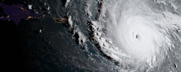 In this geocolor image captured by GOES-16 and released by the National Oceanic and Atmospheric Administration (NOAA), Hurricane Irma, a potentially catastrophic category 5 hurricane, moves westward, Tuesday morning, Sept. 5, 2017, in the Atlantic Ocean toward the Leeward Islands. In this geocolor image captured by GOES-16 and released by the National Oceanic and Atmospheric Administration (NOAA), Hurricane Irma, a potentially catastrophic category 5 hurricane, moves westward, Tuesday morning, Sept. 5, 2017, in the Atlantic Ocean toward the Leeward Islands. - Sputnik International