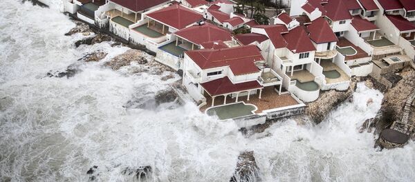 This Sept. 6, 2017 photo provided by the Dutch Defense Ministry shows a few of the homes that remained intact in the aftermath of Hurricane Irma, in St. Maarten. Irma cut a path of devastation across the northern Caribbean, leaving thousands homeless after destroying buildings and uprooting trees. This Sept. 6, 2017 photo provided by the Dutch Defense Ministry shows a few of the homes that remained intact in the aftermath of Hurricane Irma, in St. Maarten. Irma cut a path of devastation across the northern Caribbean, leaving thousands homeless after destroying buildings and uprooting trees. - Sputnik International