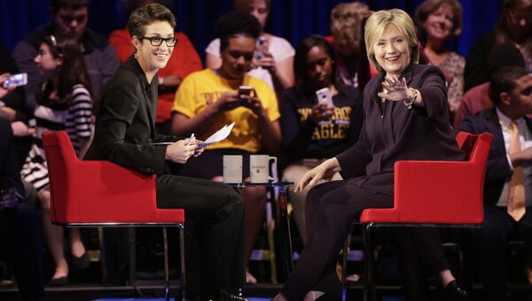 Democratic presidential candidate, Hillary Rodham Clinton, right, waves to the crowd as MSNBC's Rachel Maddow, left, watches during a democratic presidential candidate forum at Winthrop University in Rock Hill, S.C., Friday, Nov. 6, 2015. - Sputnik International