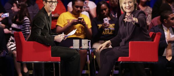 Democratic presidential candidate, Hillary Rodham Clinton, right, waves to the crowd as MSNBC's Rachel Maddow, left, watches during a democratic presidential candidate forum at Winthrop University in Rock Hill, S.C., Friday, Nov. 6, 2015. Democratic presidential candidate, Hillary Rodham Clinton, right, waves to the crowd as MSNBC's Rachel Maddow, left, watches during a democratic presidential candidate forum at Winthrop University in Rock Hill, S.C., Friday, Nov. 6, 2015. - Sputnik International