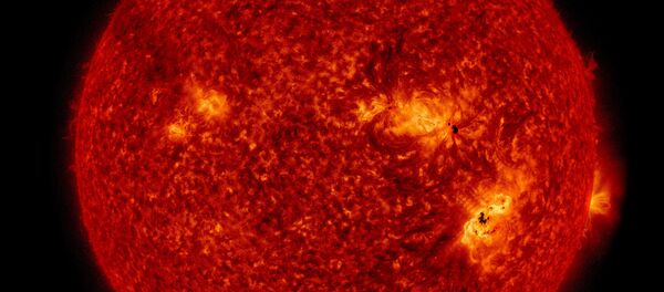 This NASA image of the enormous solar storms that occurred on September 6 shows both sunspots visible on the Sun's surface and the flare in the solar atmosphere. This NASA image of the enormous solar storms that occurred on September 6 shows both sunspots visible on the Sun's surface and the flare in the solar atmosphere. - Sputnik International