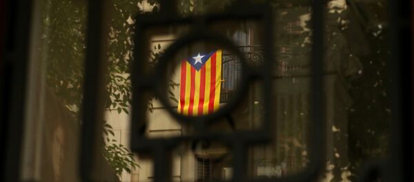 A Catalan flag hangs on a balcony in Barcelona, Spain, September 7, 2017 A Catalan flag hangs on a balcony in Barcelona, Spain, September 7, 2017 - Sputnik International