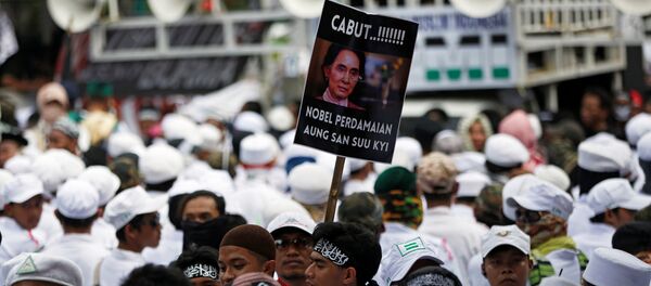 A man carries a placard during a protest led by Islamist groups near the Myanmar embassy protesting against the treatment of Rohingya Muslims, in Jakarta, Indonesia September 6, 2017. The placard reads Revoke Aung San Suu Kyi's Nobel Peace Prize! A man carries a placard during a protest led by Islamist groups near the Myanmar embassy protesting against the treatment of Rohingya Muslims, in Jakarta, Indonesia September 6, 2017. The placard reads Revoke Aung San Suu Kyi's Nobel Peace Prize! - Sputnik International