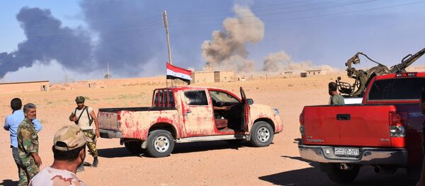 Smoke billows as Syrian government forces advance in Al-Shula on the southwestern outskirts of Deir Ezzor on September 8, 2017 - Sputnik International